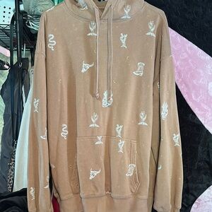 light brown hoodie with cactus & skull details